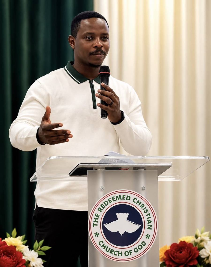 A member speaking from the pulpit during a service